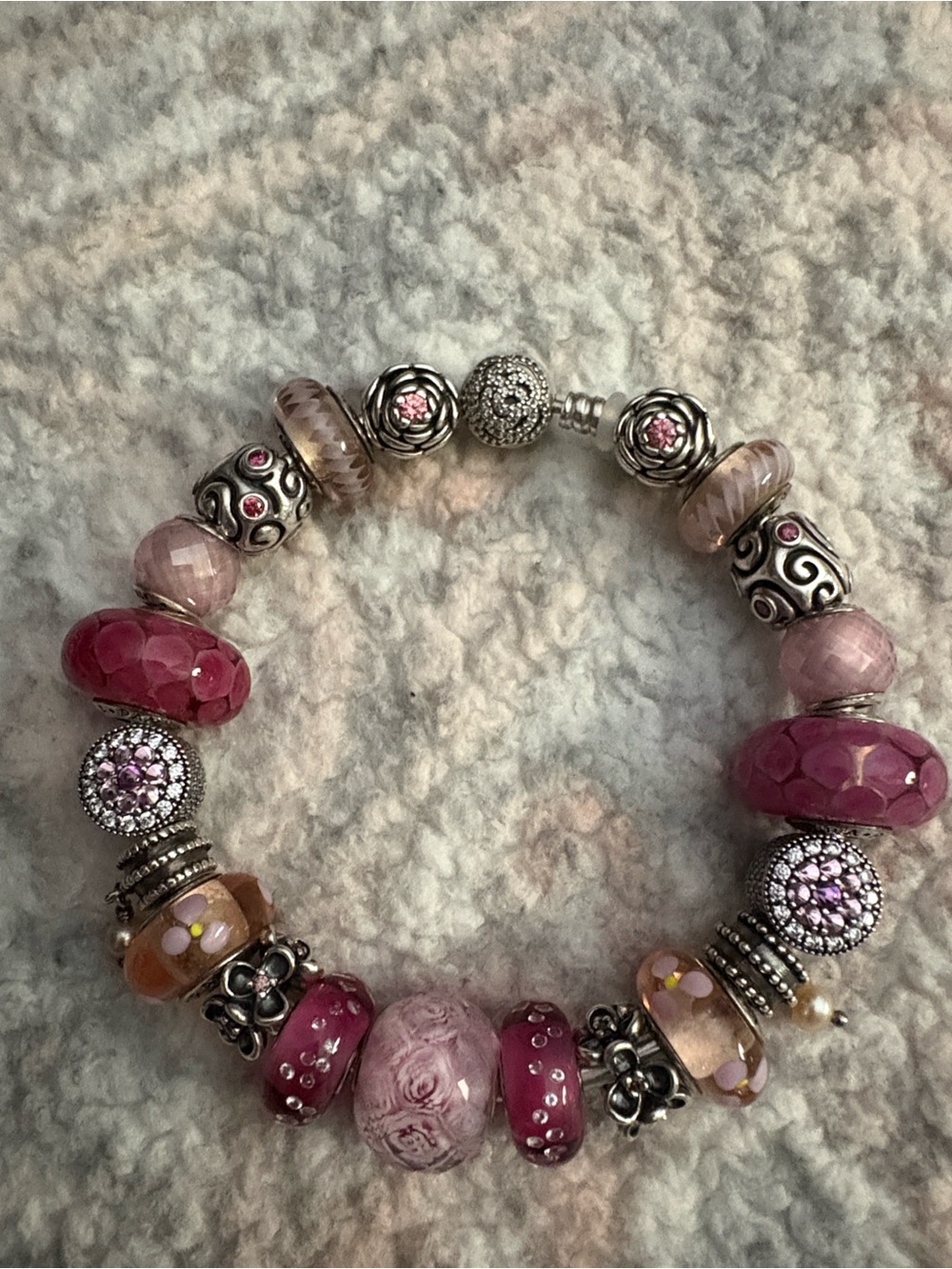 Pandora Beauty and Beast bangle with pink charms.
